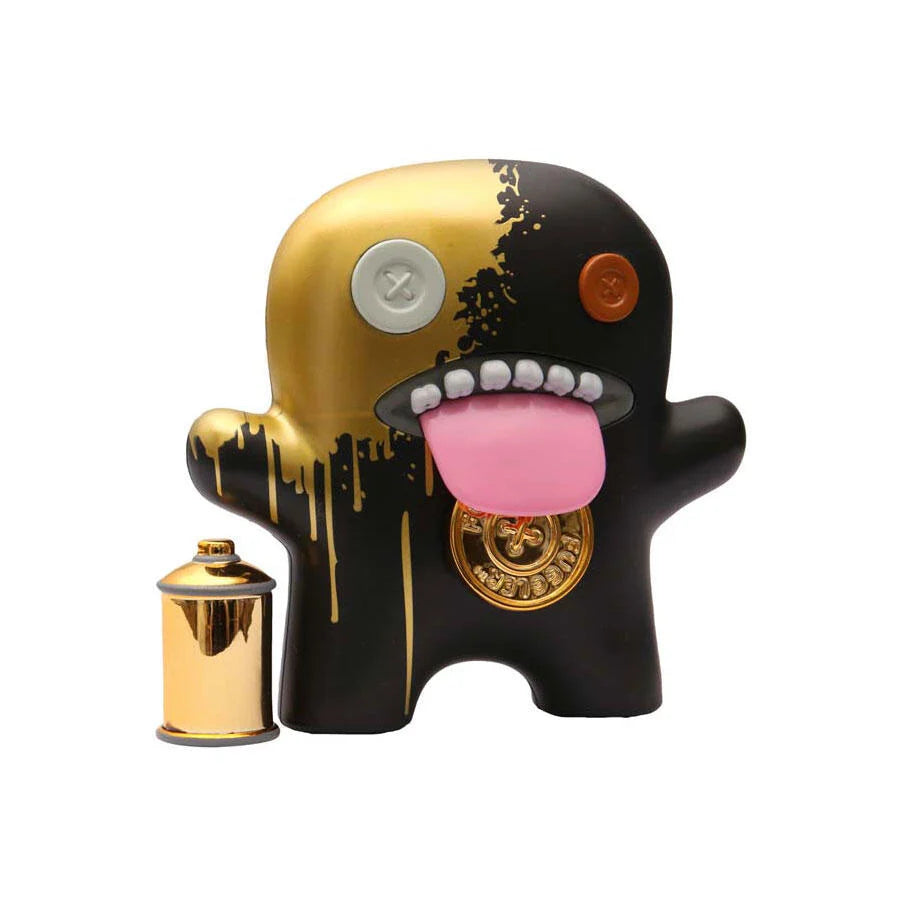 Fuggler Series 3 Gold Edition Oogah Boogah 4.5-inch figure in black and dripping gold spray paint style with a gold spray can accessory.