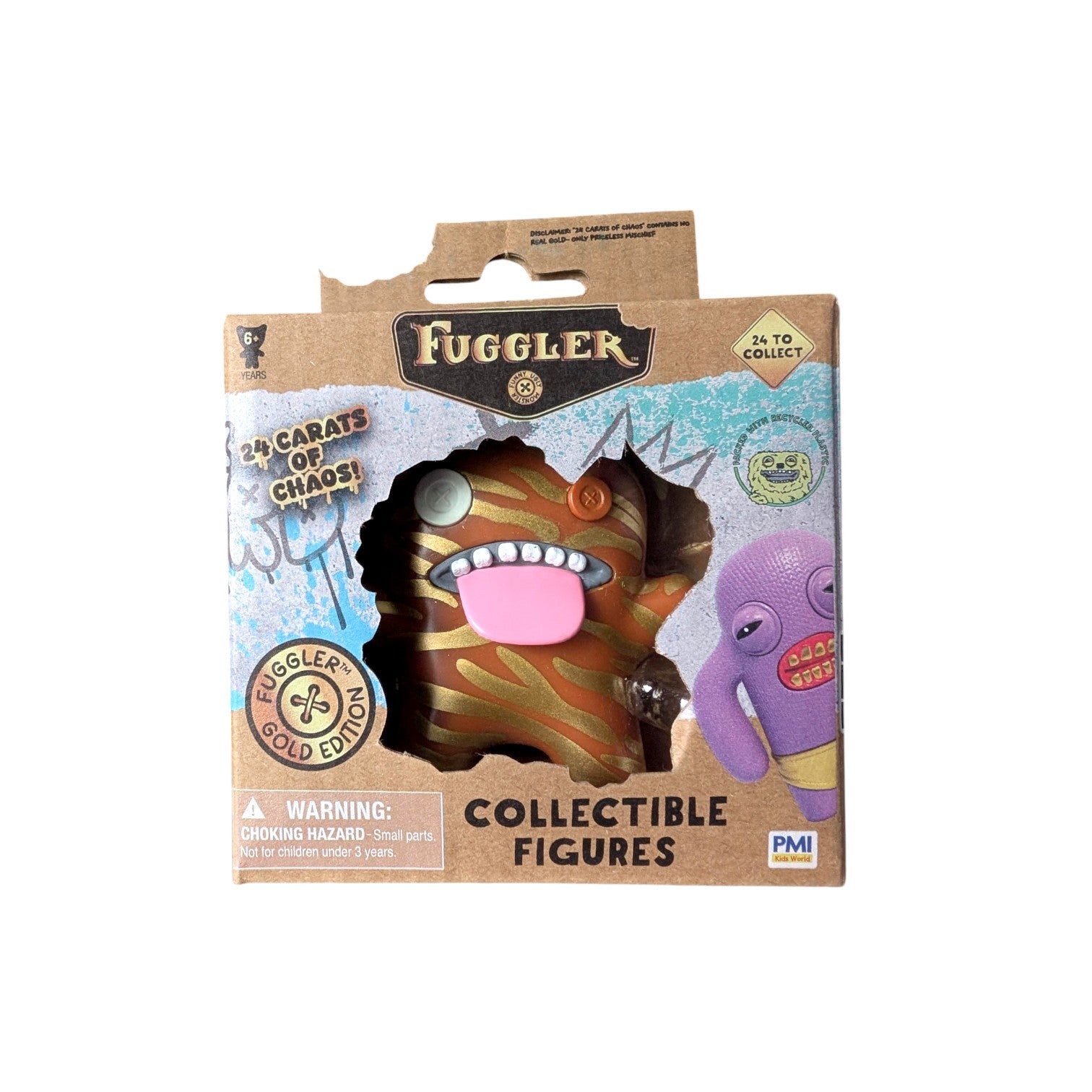 Fuggler Series 3 Gold Edition Oogah Boogah Tiger vinyl figure with orange and brown stripes, mismatched button eyes, and a pink tongue in a kraft paper window box.