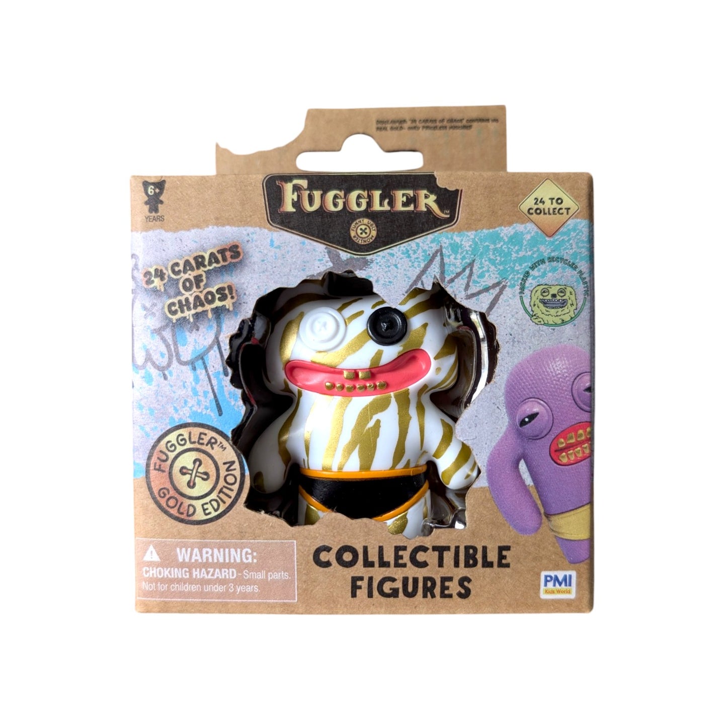 Fuggler Series 3 Gold Edition Stinkface Zebra vinyl figure featuring a white body with gold stripes, mismatched button eyes, and black underwear in a 24 Carats of Chaos window box.