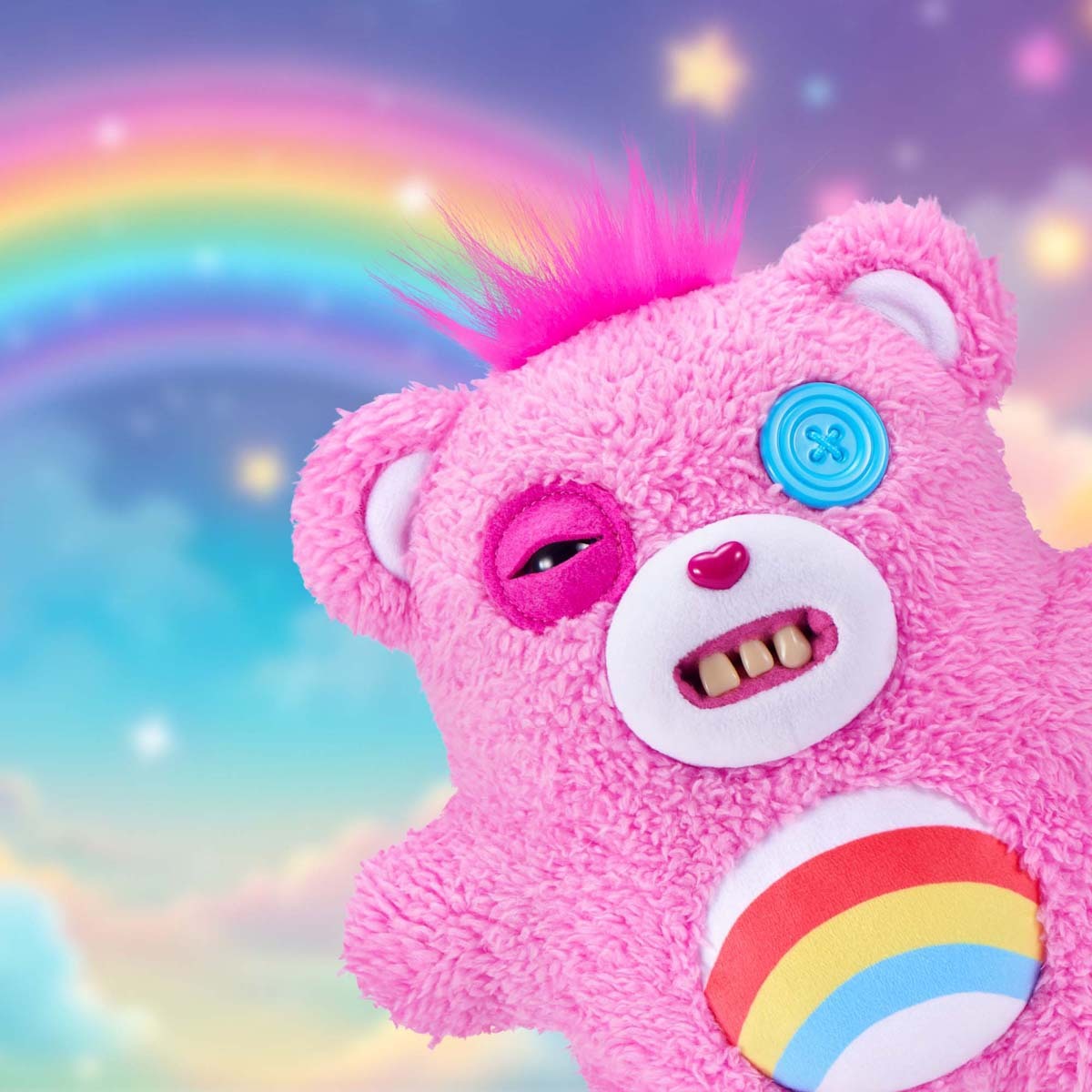 Fuggler x Care Bears Cheer Bear plush with a rainbow background