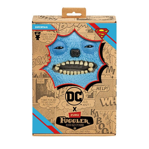 The Fuggler x DC Superman plush inside its collector box, featuring comic book style graphics, the "Superman" name tag, and the Superman Shield logo.