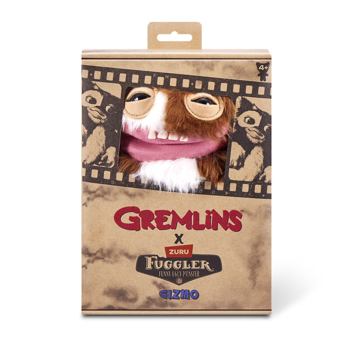 Product packaging for the Fuggler x Gremlins Gizmo plush, featuring a furry brown and white monster with human-like teeth looking out of a movie-reel box.