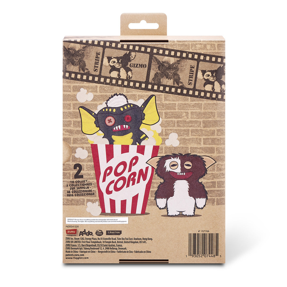 Back of Product packaging for the Fuggler x Gremlins Stripe plush, featuring a green scaly monster with a white mohawk and human-like teeth looking out of a movie-reel box.