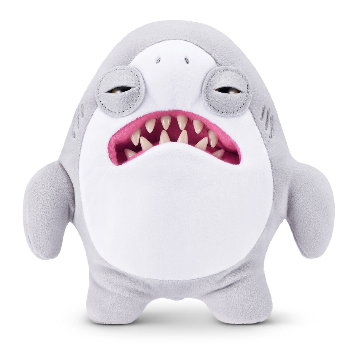 A product shot of the Fuggler x Jaws 9-Inch plush toy, a grey shark with wild eyes and a mouth full of human-like teeth instead of shark teeth.