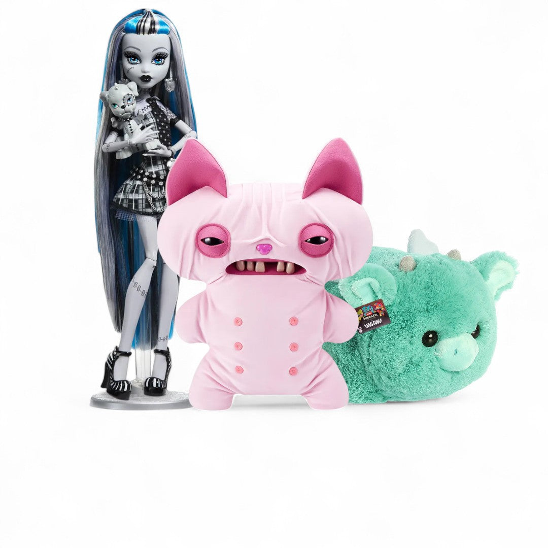 Monster High doll with two plush toys, one pink and one green, on a white background