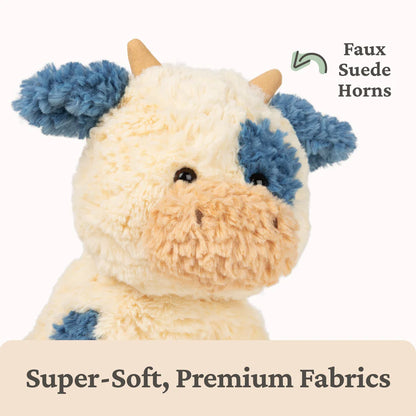 Plush toy with faux suede horns and text indicating super-soft premium fabrics