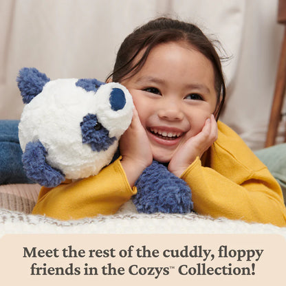 Child holding a plush toy with text about the Cozys Collection