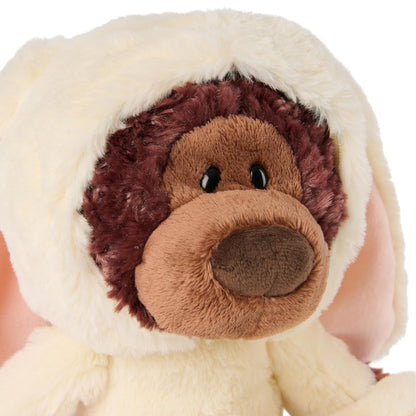 Close-up of a plush toy with a brown face and white ears.