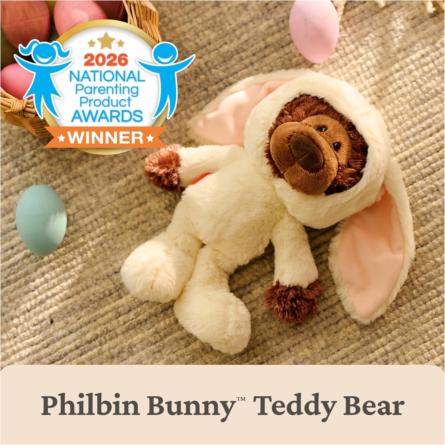 Plush toy bear in bunny costume with 2026 National Parenting Product Awards winner badge on a textured surface.