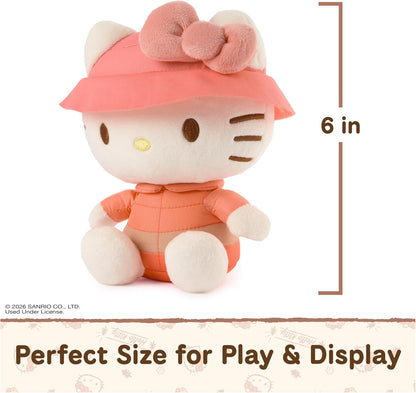 GUND Sanrio Camp Hello Kitty 6-inch plush toy wearing a coral puffer jacket and pink bucket hat