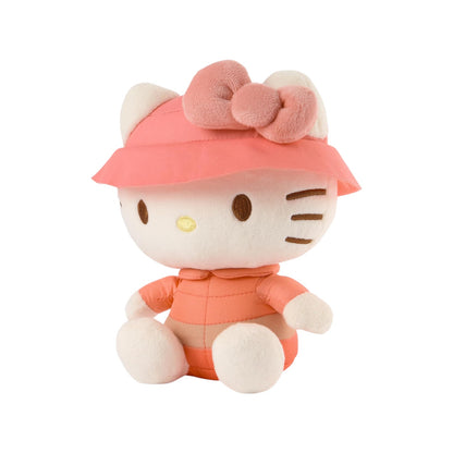Plush toy resembling a character with a pink hat and outfit on a white background