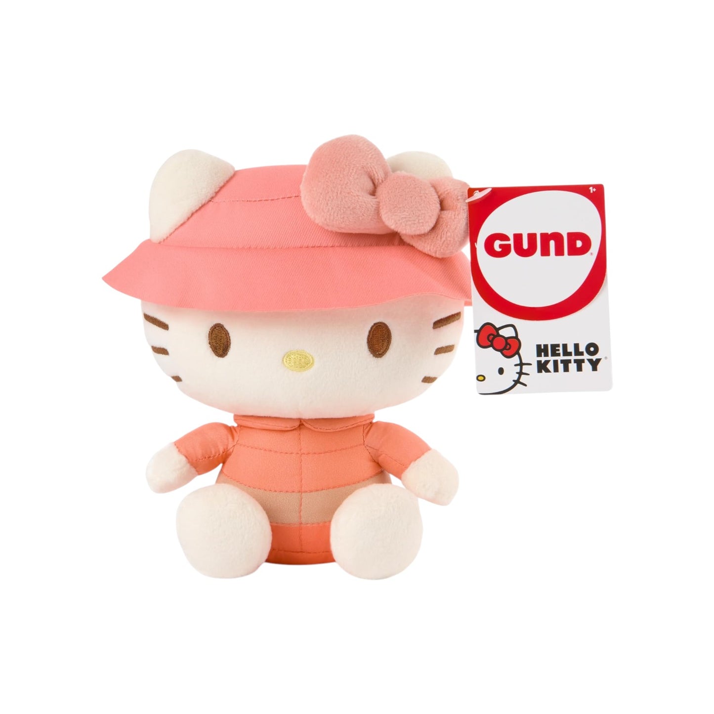 Hello Kitty plush toy wearing a pink outfit and hat with a GUND logo in the background.