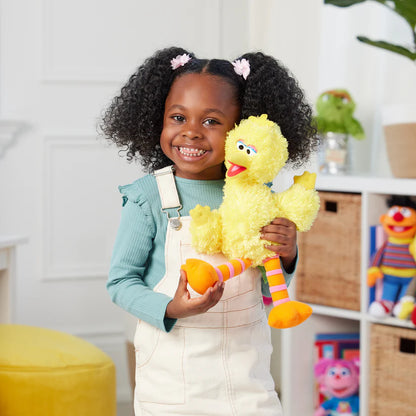 Child holding a yellow plush toy in a room with toys and furniture