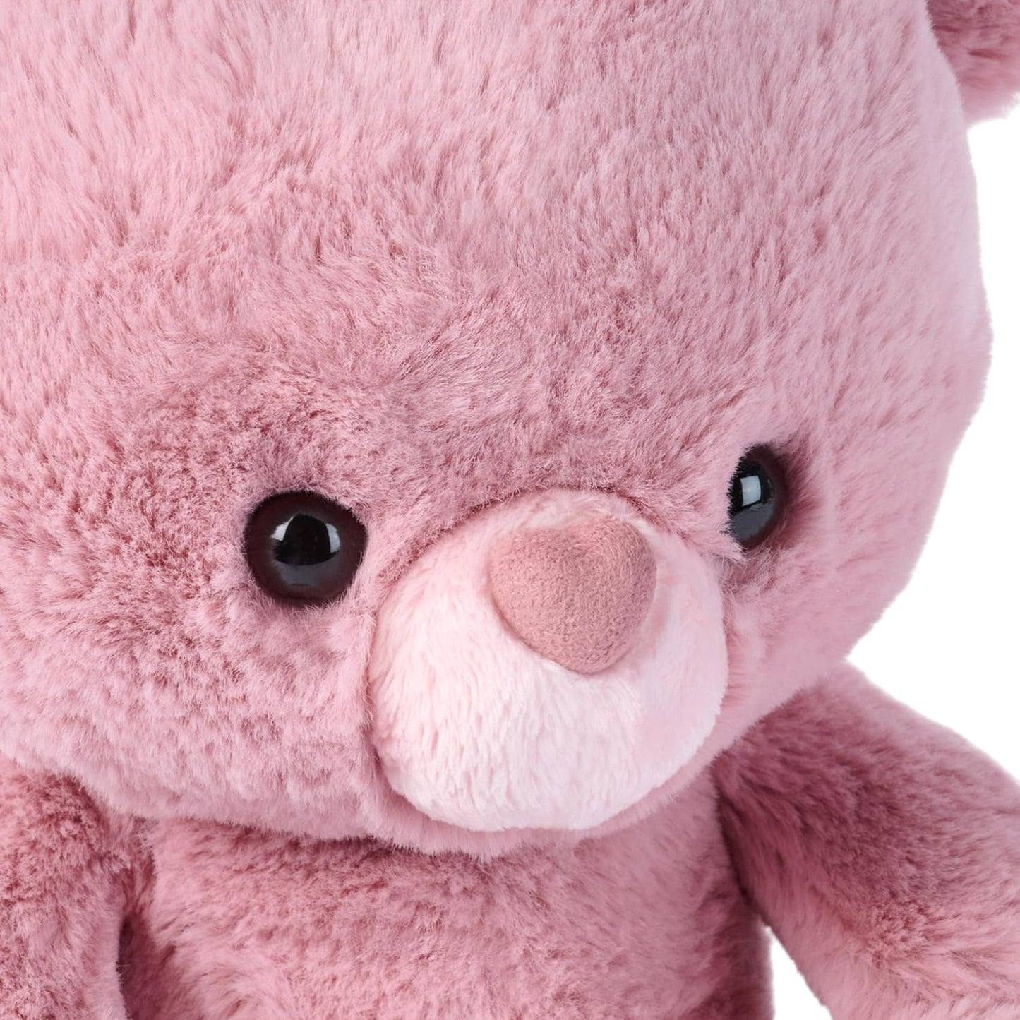 Close-up of GUND Valentine's Day Moment Kai Rose 10-inch plush teddy bear, featuring pink fur and a heart-shaped nose.