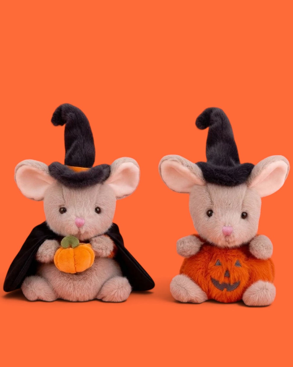 Two plush mouse toys dressed in Halloween costumes, one in a black witch hat and cape holding a small orange pumpkin, and the other in a black witch hat with an orange jack-o'-lantern body, set against a solid orange background.