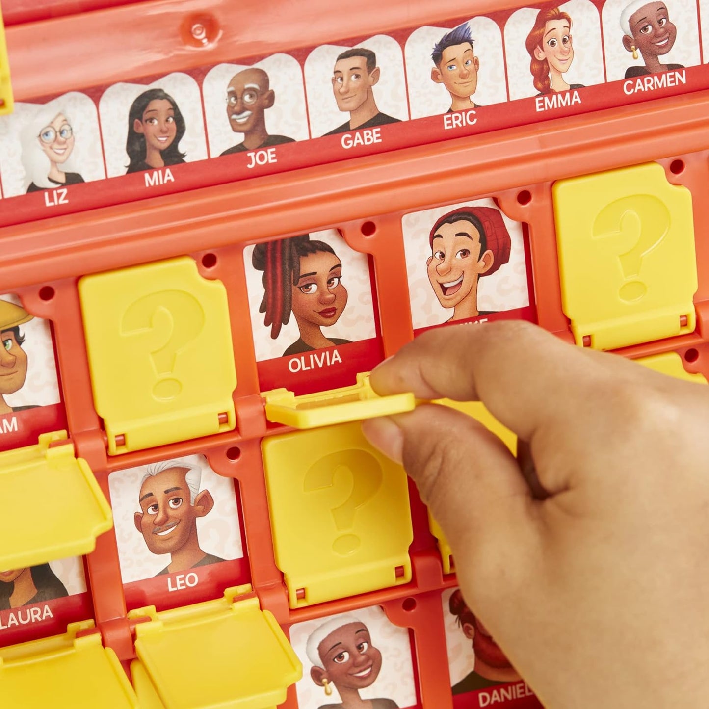 Toy character selection board with various faces and a hand choosing a face.