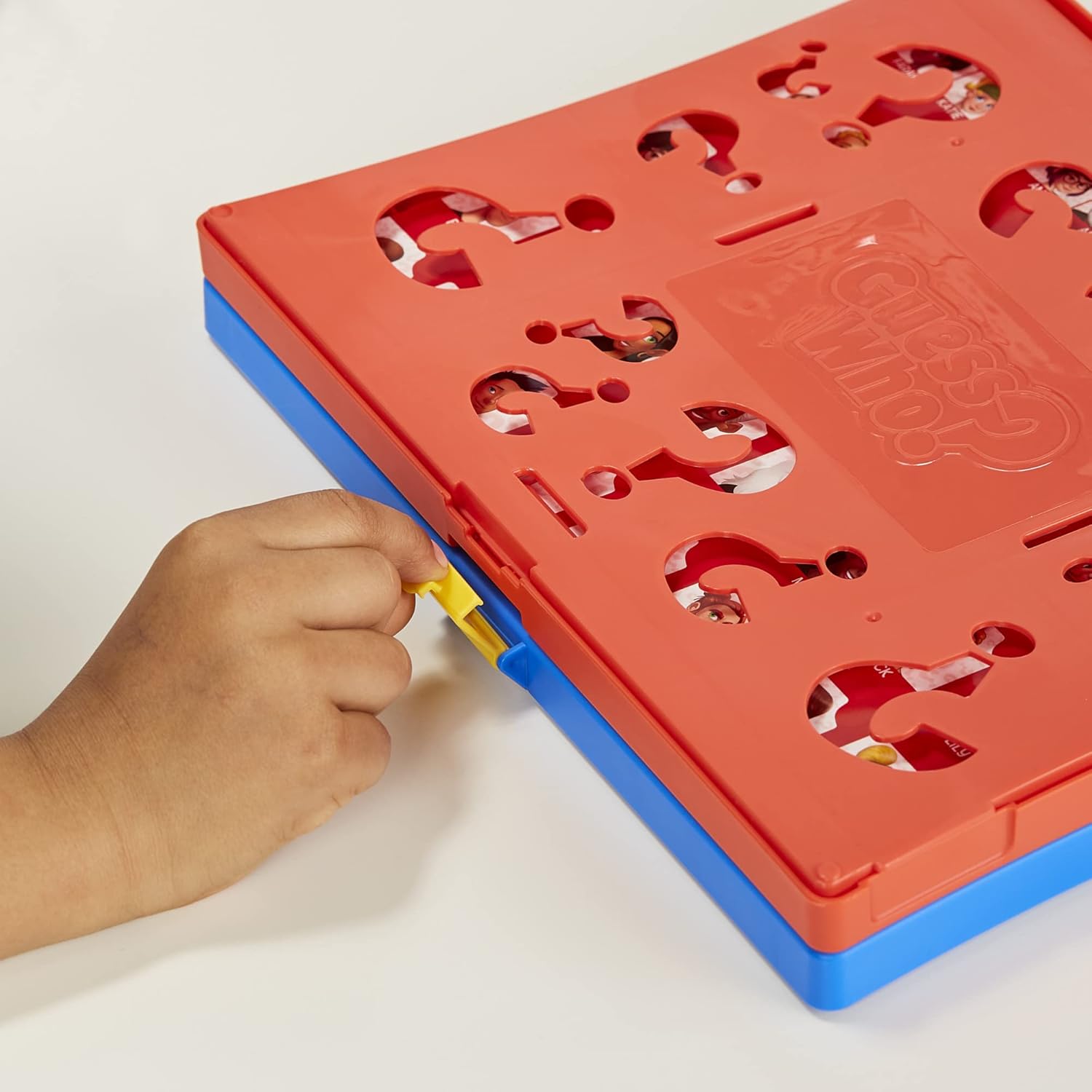 Child's hand interacting with a colorful puzzle board on a white background