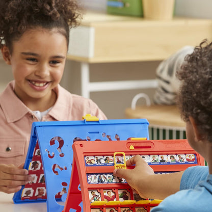 Two children playing Guess Who? in a classroom setting.