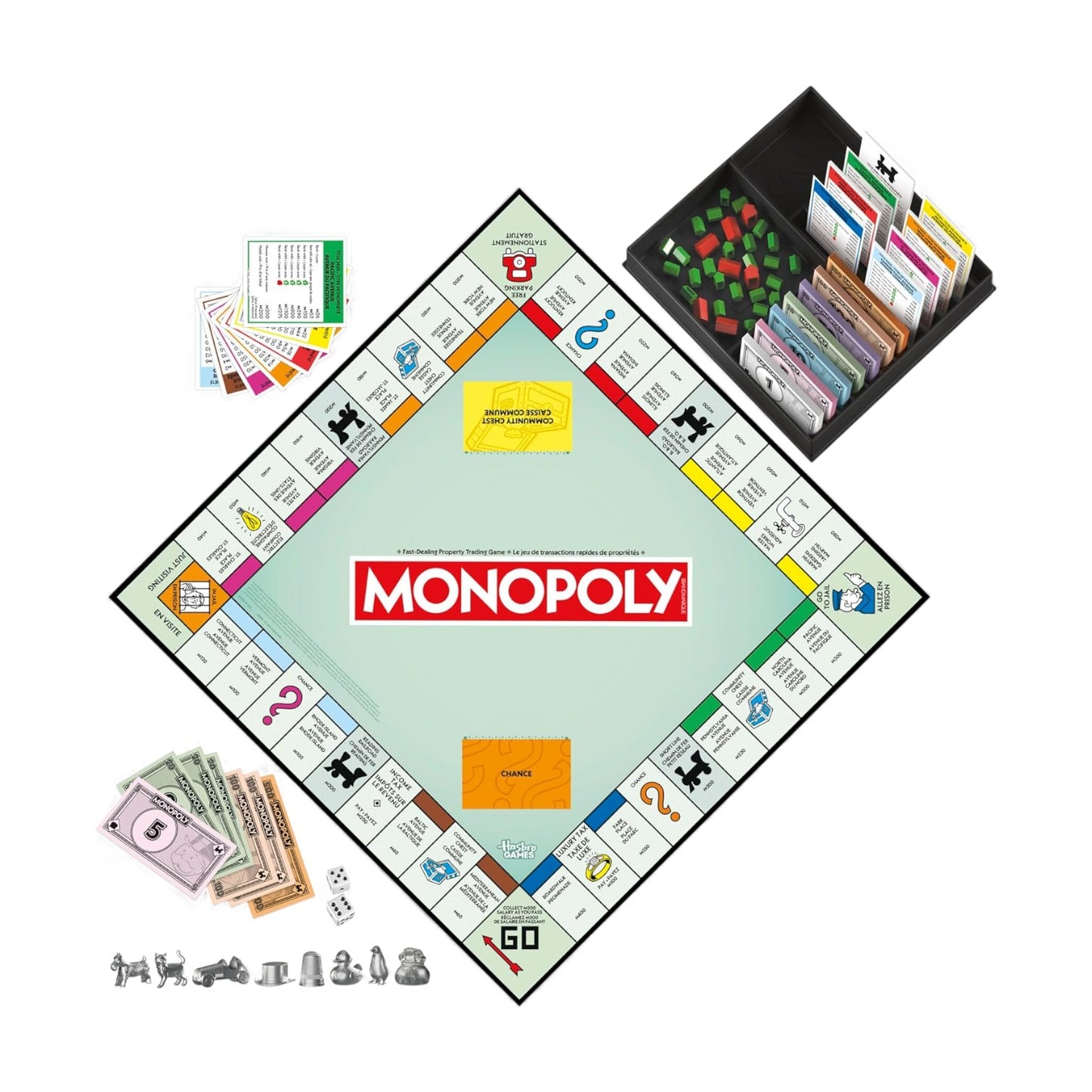 Monopoly board game set with pieces and cards on a white background