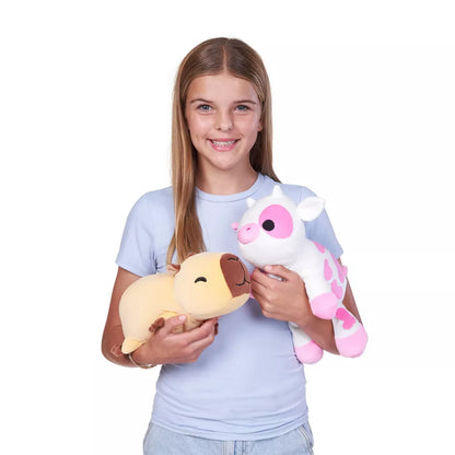 Girl holding two plush toys, Small Hug-A-Lumps Series 2 weighted plush toy by ZURU