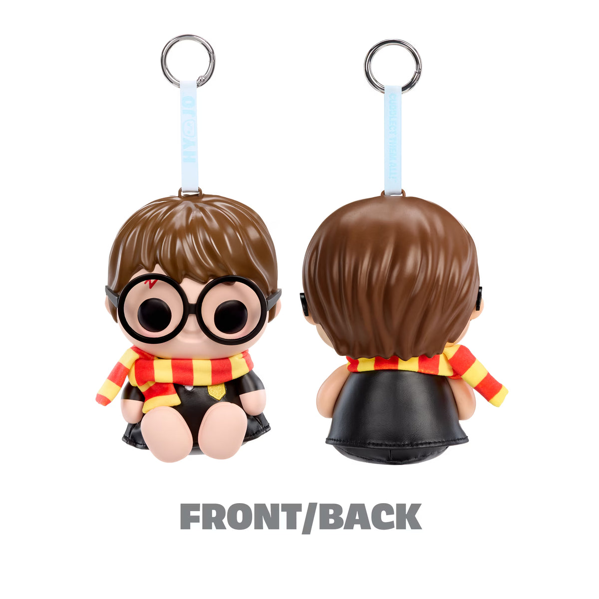 A small character keychain shown from the front and back on a white background. The figure has brown hair, round black glasses, a red and yellow striped scarf, and a black outfit, with a light blue strap and metal key ring at the top.
