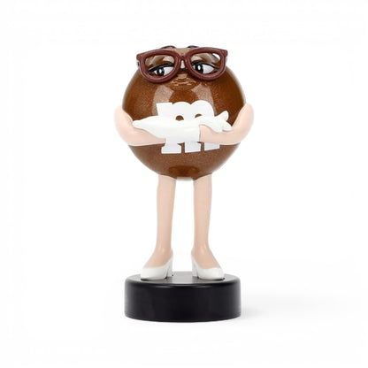 Jada Toys M&M's Brown Character 2.5-inch Metalfigs die-cast figure mounted on a black display pedestal.