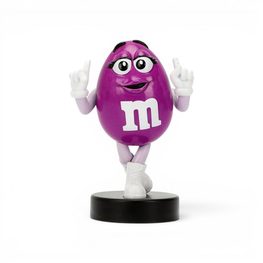 Jada Toys M&M's Purple Character 2.5-inch Metalfigs die-cast figure mounted on a black display pedestal.