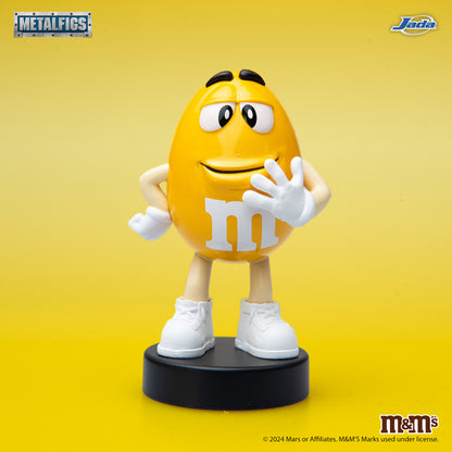 Jada Toys M&M's Yellow Character 2.5-inch Metalfigs die-cast figure mounted on a black display pedestal.
