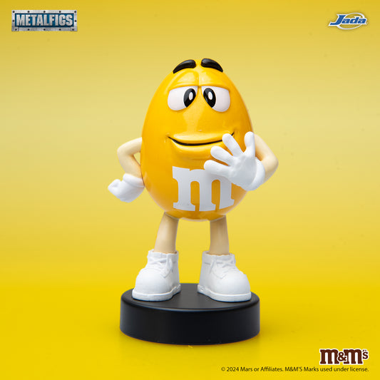 Jada Toys M&M's Yellow Character 2.5-inch Metalfigs die-cast figure mounted on a black display pedestal.