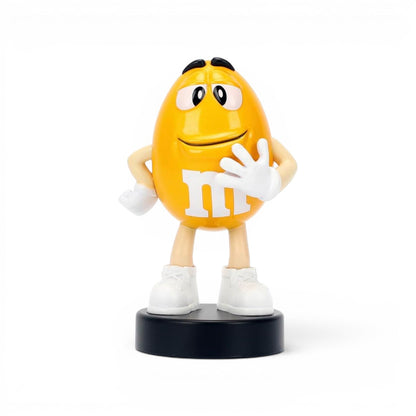 Jada Toys M&M's Yellow Character 2.5-inch Metalfigs die-cast figure mounted on a black display pedestal.