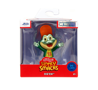 A packaged die-cast Metalfigs figure of the Honey Smacks character Dig 'Em, shown in its original retail window box with a hanger tab.