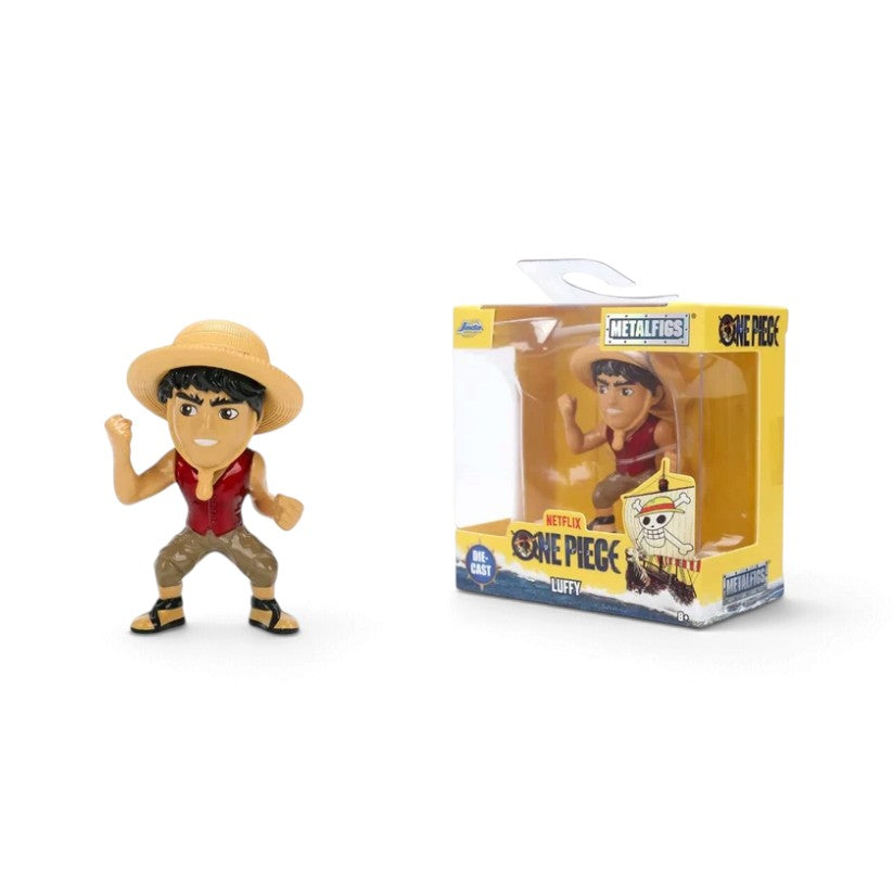 Metalfigs One Piece Luffy vinyl figure shown next to its original packaging box on a plain white background.