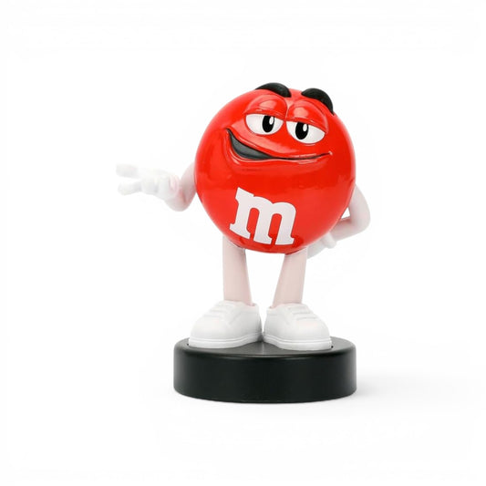 Jada Toys M&M's Red Character 2.5-inch die-cast metal figure standing confidently with hands on hips on a black pedestal.