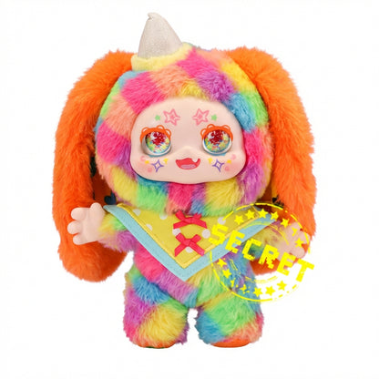 Kimmon Camouflage Rhapsody plush pendant character with rainbow hair and outfit on a white background