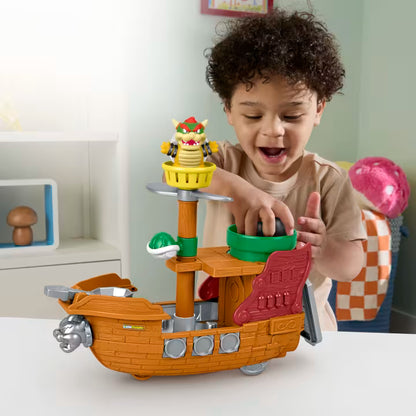 Little People Super Mario Bowser’s Airship playset featuring a toy boat with a cannonball launcher, Bowser figure, and spinning play features.