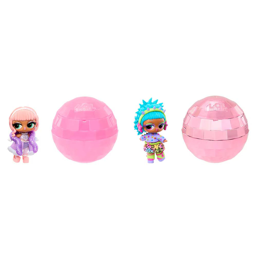 Two pink faceted surprise egg capsules and two small doll figures on a plain white background. One doll has pink hair and a purple outfit, and the other has bright blue hair and a multicolor outfit.
