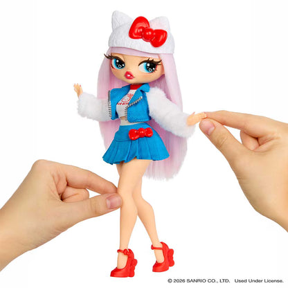 A Sanrio Hello Kitty doll with long pink hair, a white cat-ear hat with a red bow, a blue outfit, and red shoes, being held by two hands against a white background.