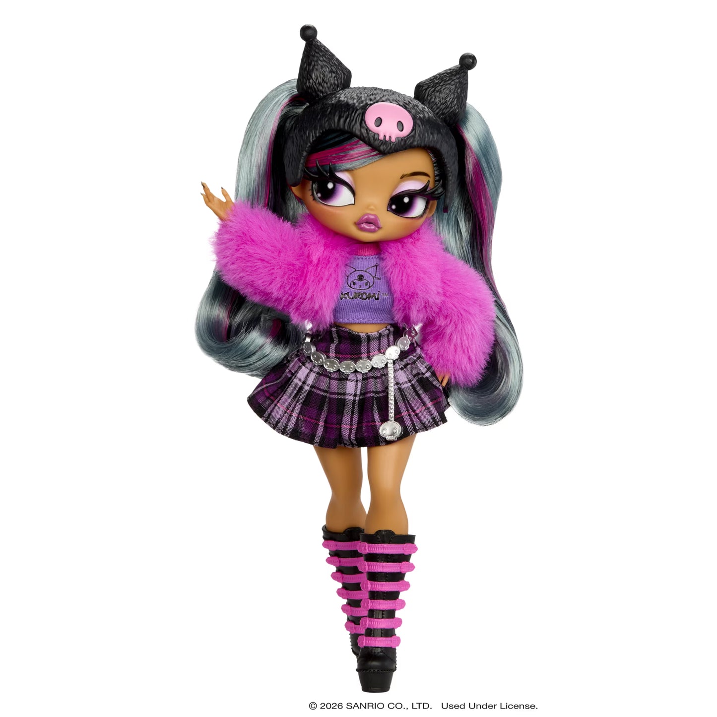 A Sanrio Kuromi doll with long gray and pink hair, wearing a black cat-ear headband with a pink pig emblem, a bright pink faux-fur jacket, a purple plaid top and skirt, and pink-and-black striped leg warmers, shown on a plain white background.