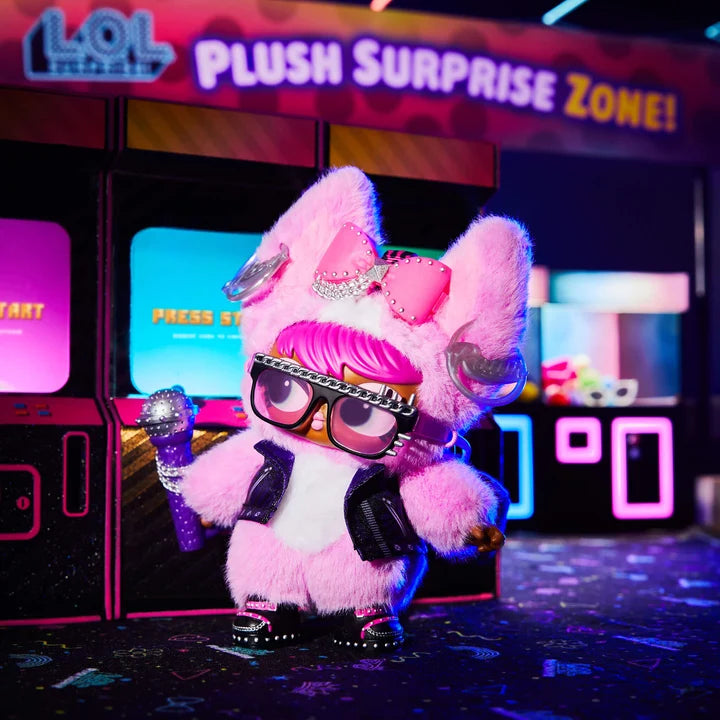 Pink plush toy with glasses and a microphone in front of a 'Plush Surprise Zone' sign.
