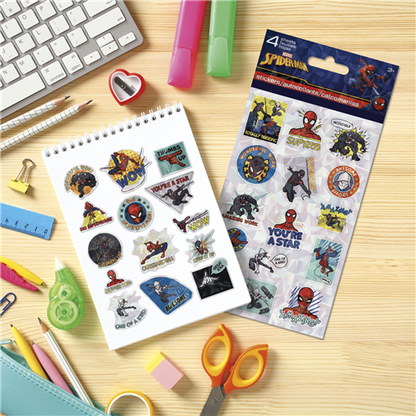 Spider-Man stickers on a desk with stationery items