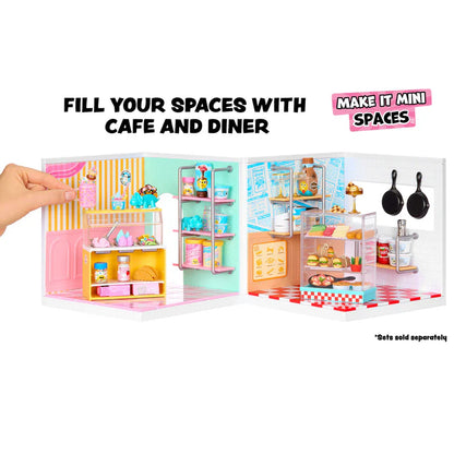 Miniature cafe and diner set with a hand holding it open, showing various items inside.