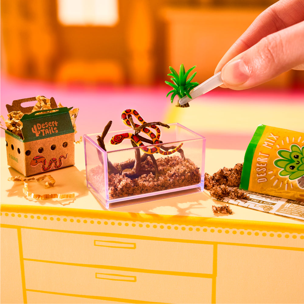 MGA's Miniverse Make It Mini Animals Series 2 surprise capsule and crafted miniature mouse with a rocket ship tube habitat.