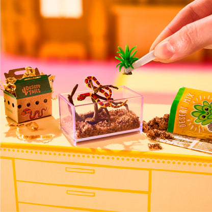 MGA's Miniverse Make It Mini Animals Series 2 surprise capsule and crafted miniature mouse with a rocket ship tube habitat.