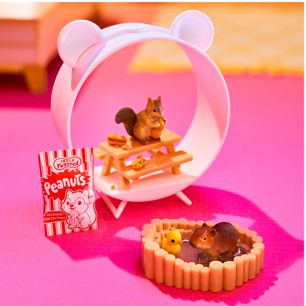 MGA's Miniverse Make It Mini Animals Series 2 surprise capsule and crafted miniature mouse with a rocket ship tube habitat.