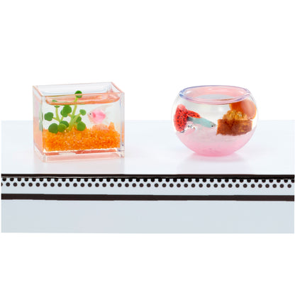 MGA's Miniverse Make It Mini Animals Series 2 surprise capsule and crafted miniature mouse with a rocket ship tube habitat.