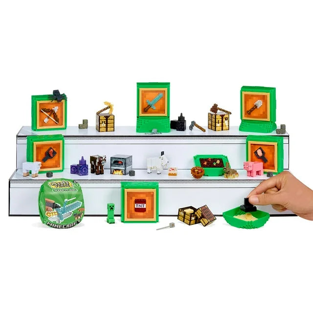 close-up of the stackable green display blocks and the bonus Nether Portal construction, surrounded by TNT and tool replicas.