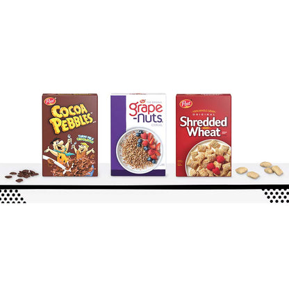 Three Procter & Gamble cereal boxes displayed side by side on a white shelf: Cocoa Pebbles, Grape Nuts, and Shredded Wheat, with scattered cereal pieces on either side.