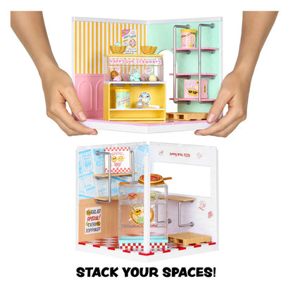 A promotional image demonstrating the stacking feature of MGA's Miniverse Make It Mini Spaces. Hands are shown holding the pastel Ice Cream Shop stacked directly on top of the rustic Pizza Shop, creating a multi-level miniature display.