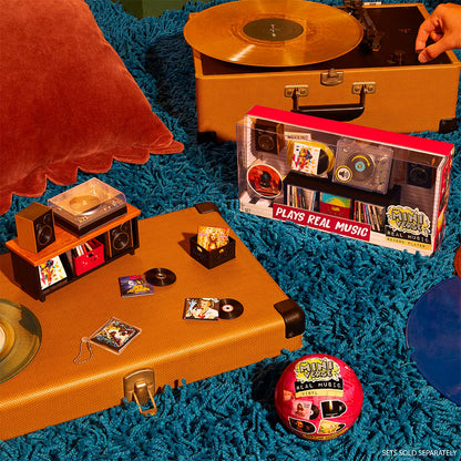 A hot pink mystery blind pack ball for MGA's Miniverse Real Music Vinyl surrounded by mini playable vinyl records, sleeves, and crates.