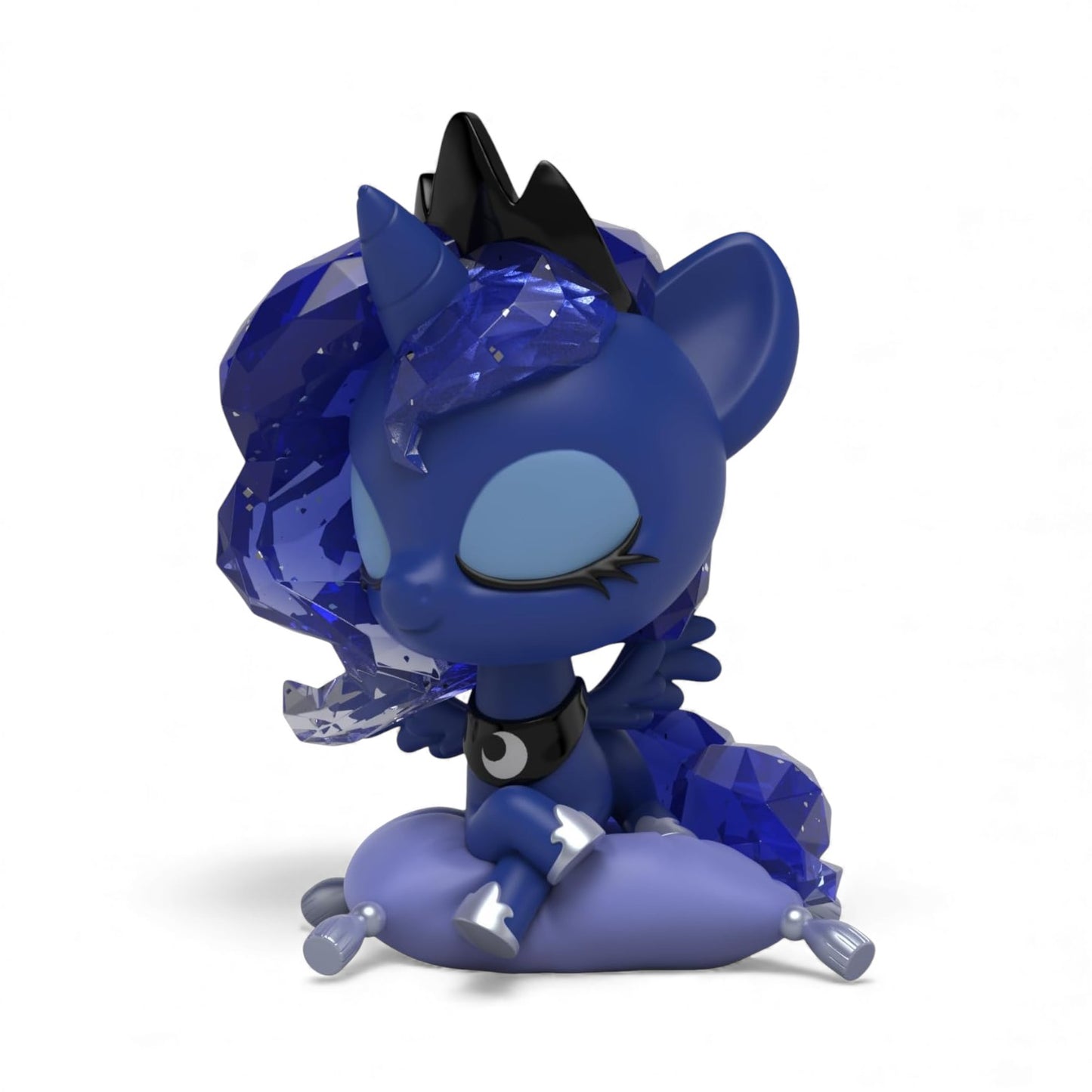 Product view of Mighty Jaxx Kwistal Fwenz Princess Luna, a 6-inch vinyl figure with translucent blue crystal mane with starry patterns, sitting on a pillow.